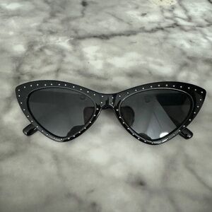 Cute trendy cat-eye sunglasses, with studs around the frames.
